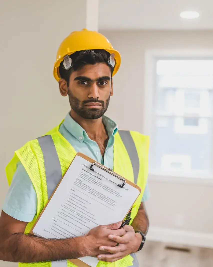 Building manager with a clipboard inside a property