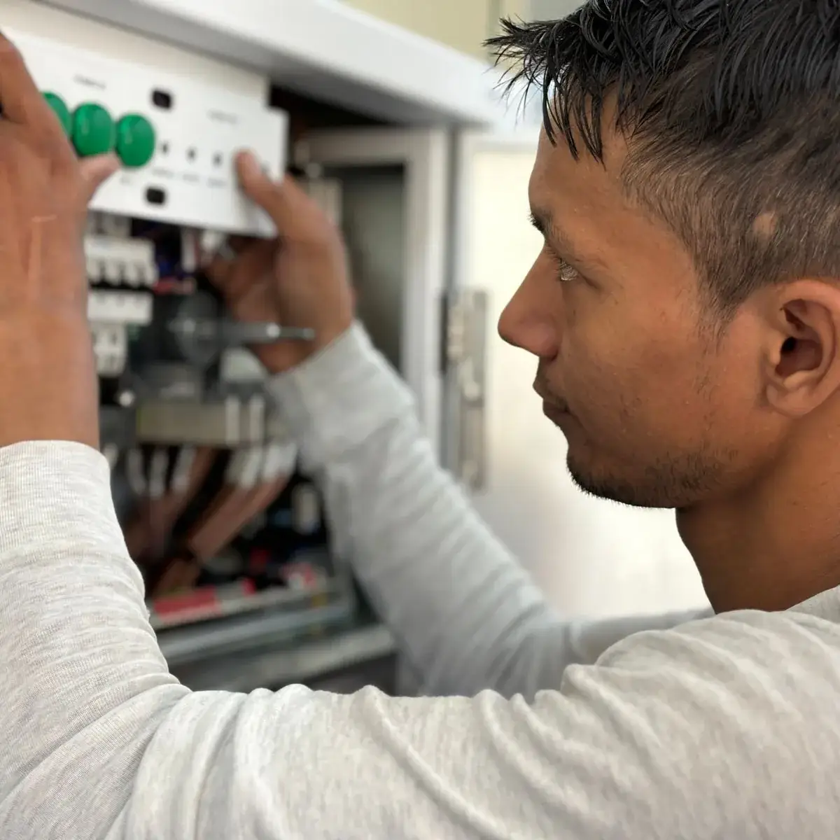 Electrician checking a distribution board
